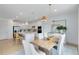 Well-lit kitchen and dining area featuring modern appliances and ample cabinet space at 6033 Tree Crossing Ln, St Cloud, FL 34771
