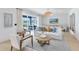 Inviting living room with light wood floors, comfortable seating, stylish decor and sliding glass door to patio at 6033 Tree Crossing Ln, St Cloud, FL 34771