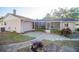 Backyard featuring a screened-in patio area, offering a blend of indoor-outdoor living and relaxation at 613 Andrew St, Altamonte Springs, FL 32714