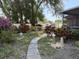 Lush backyard featuring a stone pathway and mature landscaping at 613 Andrew St, Altamonte Springs, FL 32714