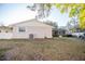 View of the backyard with a screened-in porch, showing the outdoor space and potential for relaxation at 613 Andrew St, Altamonte Springs, FL 32714