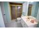 Clean bathroom with a glass-enclosed shower, toilet, vanity and sink at 613 Andrew St, Altamonte Springs, FL 32714