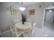 Cozy dining area with white table, chairs, and marble flooring at 613 Andrew St, Altamonte Springs, FL 32714