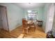 Cozy dining room with an oval table, four chairs, and access to the kitchen at 613 Andrew St, Altamonte Springs, FL 32714