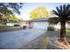 Spacious driveway leading to a well-maintained home with lush landscaping at 613 Andrew St, Altamonte Springs, FL 32714