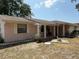 Charming single-story home with well-maintained lawn and inviting front porch, showcasing a peaceful residential setting at 613 Andrew St, Altamonte Springs, FL 32714