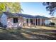 Charming single-story home with a well-maintained lawn and inviting front porch at 613 Andrew St, Altamonte Springs, FL 32714
