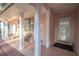 Inviting front porch with pink columns, chairs, and a welcoming entrance door at 613 Andrew St, Altamonte Springs, FL 32714