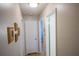 Hallway with three closed doors, hanging wall art, and overhead lighting at 613 Andrew St, Altamonte Springs, FL 32714