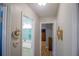 View of the hallway with several rooms visible and hanging wall art at 613 Andrew St, Altamonte Springs, FL 32714