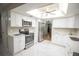 Bright kitchen with stainless steel appliances, white cabinets, and marble tile flooring at 613 Andrew St, Altamonte Springs, FL 32714