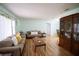 Inviting living room featuring hardwood floors, comfortable seating, and bright, natural light at 613 Andrew St, Altamonte Springs, FL 32714
