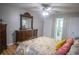 Bedroom with hardwood floors and a large window, plus an ensuite bathroom at 613 Andrew St, Altamonte Springs, FL 32714