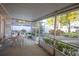 Relaxing screened-in patio with a table and chairs overlooking the backyard at 613 Andrew St, Altamonte Springs, FL 32714