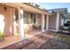 Inviting front porch with comfortable seating and decorative brick accents, perfect for enjoying a relaxing outdoor space at 613 Andrew St, Altamonte Springs, FL 32714