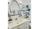 Charming bathroom featuring a decorative mirror and accented with eye-catching blue tile trim at 714 West Ct, Longwood, FL 32750