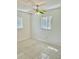 Bright bedroom featuring tiled floors, white walls, and natural light at 714 West Ct, Longwood, FL 32750