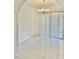 Bright dining room with tile floors, chandelier, and vertical blinds over sliding glass doors at 714 West Ct, Longwood, FL 32750