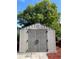 Durable outdoor storage shed with double doors and a secure latch for tools and equipment at 714 West Ct, Longwood, FL 32750