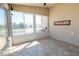 Bright Florida room features neutral tile flooring, sliding glass windows, and a ceiling fan for year-round enjoyment at 790 Blake Ln, The Villages, FL 32162