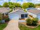 Charming single-story home with a well-manicured lawn, white picket fence, and attached one car garage at 790 Blake Ln, The Villages, FL 32162