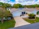 Charming single-story home featuring a one-car garage, a lovely yard, and a welcoming, screened-in porch at 790 Blake Ln, The Villages, FL 32162