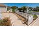 Well maintained yard featuring concrete walkways, mature landscaping, and a decorative white picket fence at 790 Blake Ln, The Villages, FL 32162