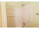 Shower featuring white tile surround and a shower head with temperature controls at 790 Blake Ln, The Villages, FL 32162