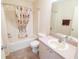 Well-maintained bathroom with a shower-tub combination, toilet, and a spacious sink vanity area at 8201 Se 169Th Palownia Loop, The Villages, FL 32162