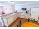 Well-lit kitchen featuring white cabinets, modern appliances, and a breakfast bar for easy dining at 8201 Se 169Th Palownia Loop, The Villages, FL 32162