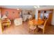 Open-concept living and kitchen area provides a spacious and inviting atmosphere with hardwood floors and warm colors at 8201 Se 169Th Palownia Loop, The Villages, FL 32162