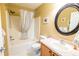 Clean bathroom featuring a shower-tub combo, classic tiling, and a vanity with sink at 8233 Se 169Th Palownia Loop, The Villages, FL 32162