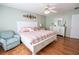 Bright bedroom showcasing a full bed set, ample natural light and decor at 8233 Se 169Th Palownia Loop, The Villages, FL 32162