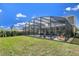 Expansive backyard with screened pool and plenty of green space at 8549 Lovett Ave, Orlando, FL 32832