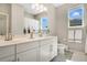 Bright bathroom with dual sinks, natural light, and modern fixtures at 8549 Lovett Ave, Orlando, FL 32832