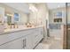 Elegant bathroom with dual sinks, a soaking tub, and a separate shower at 8549 Lovett Ave, Orlando, FL 32832