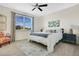 Cozy bedroom featuring a large window, comfortable bedding, and stylish decor at 8549 Lovett Ave, Orlando, FL 32832