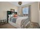 Comfortable bedroom with stylish decor and a window with shutters at 8549 Lovett Ave, Orlando, FL 32832