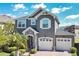 Beautiful two-story home with a two car garage and stone accents at 8549 Lovett Ave, Orlando, FL 32832