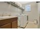 Convenient laundry room with sink, window and storage at 8549 Lovett Ave, Orlando, FL 32832