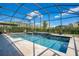 Sparkling pool with screened enclosure offers privacy and relaxation at 8549 Lovett Ave, Orlando, FL 32832
