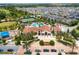 Aerial view of the community featuring the pool, clubhouse, playground, and manicured landscaping at 9513 Amber Chestnut Way, Winter Garden, FL 34787