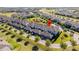 An aerial view of a row of attached townhomes, emphasizing their community layout and location at 9513 Amber Chestnut Way, Winter Garden, FL 34787