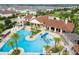 Stunning aerial view of the community pool, splash pad, and the meticulously landscaped grounds at 9513 Amber Chestnut Way, Winter Garden, FL 34787