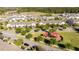 Wide aerial view highlighting the community layout, including a playground and surrounding residential homes at 9513 Amber Chestnut Way, Winter Garden, FL 34787