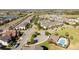 Community aerial view featuring neighborhood pool, clubhouse, and residential homes near lakes and green spaces at 9513 Amber Chestnut Way, Winter Garden, FL 34787