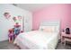 Bright, cheerful bedroom featuring a bed, dollhouse, vanity and ample play space at 9513 Amber Chestnut Way, Winter Garden, FL 34787