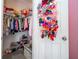 Well-organized closet featuring clothing rack, shelving, and toy storage, maximizing space and functionality at 9513 Amber Chestnut Way, Winter Garden, FL 34787