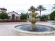 Community clubhouse with a beautiful fountain feature, enhancing curb appeal at 9513 Amber Chestnut Way, Winter Garden, FL 34787