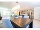 Open-concept dining area featuring a modern chandelier and a view of the well-equipped kitchen at 9513 Amber Chestnut Way, Winter Garden, FL 34787